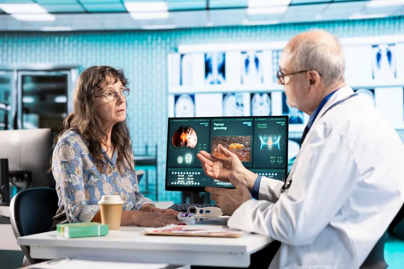 Doctor discussing heart images with a patient